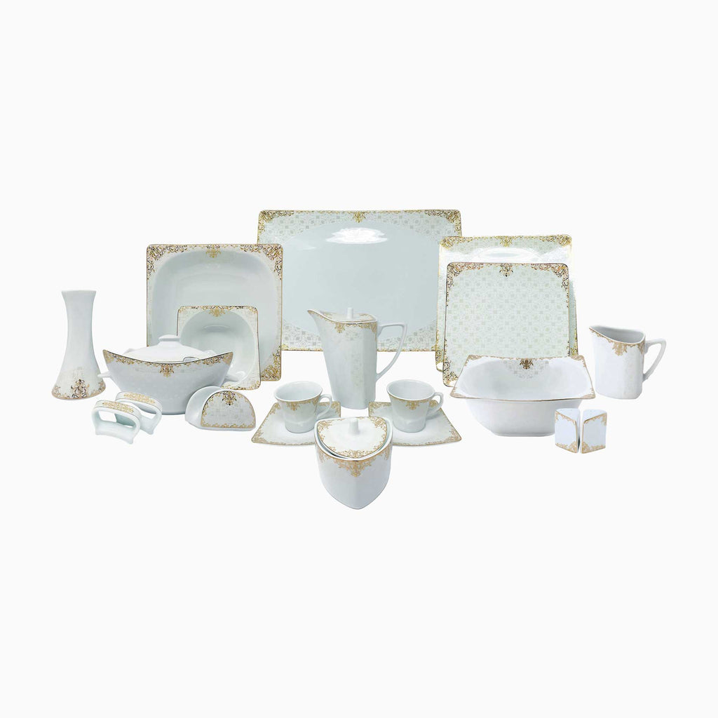 Set of white ceramic dinnerware with gold accents