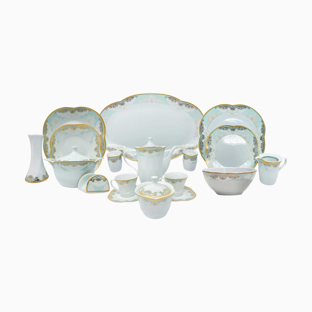 Elegant white porcelain dinnerware set with intricate gold clover detailing, designed for refined and luxurious dining experiences. Noble Home Gifts
