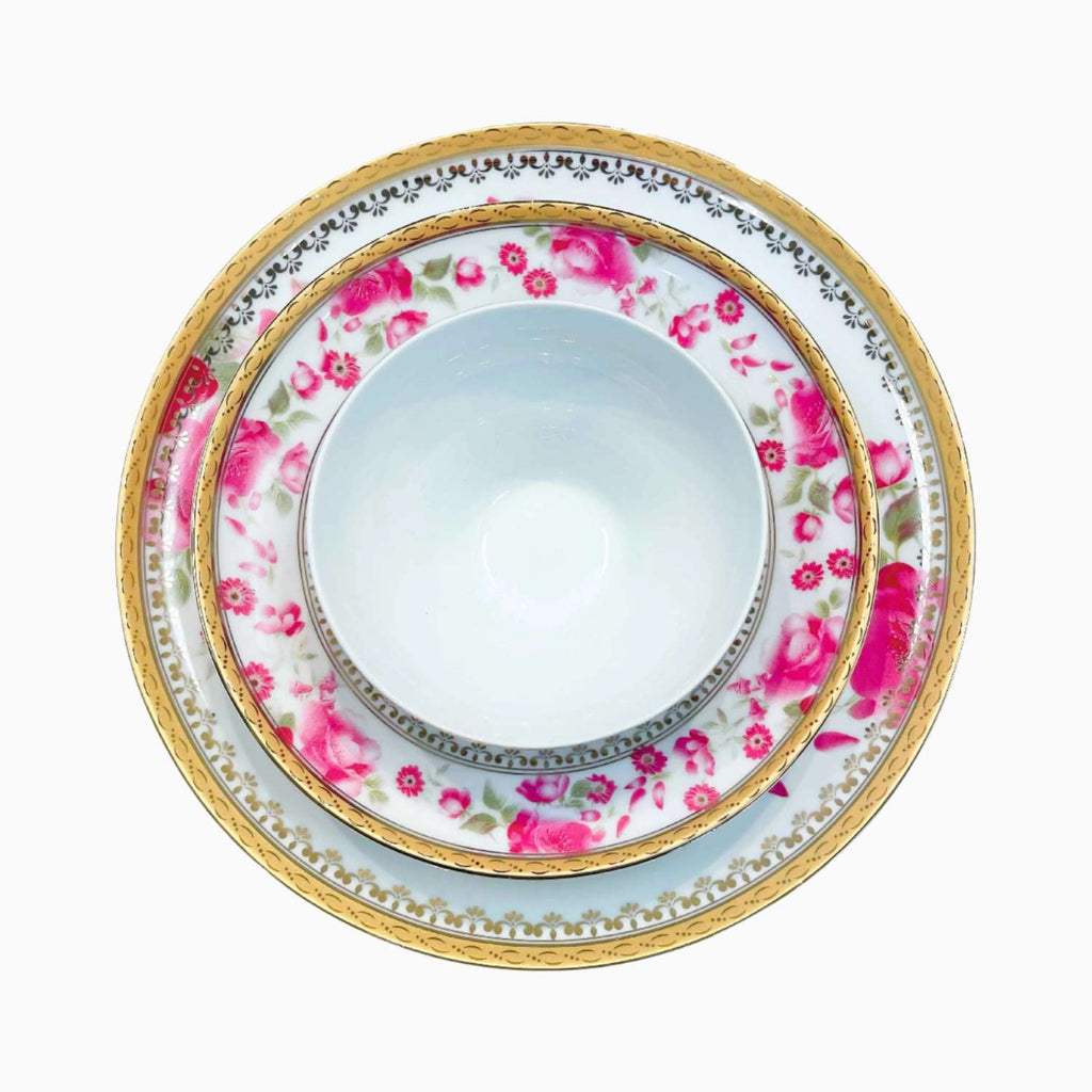 Decorative plate with floral pattern and gold rim on a white background