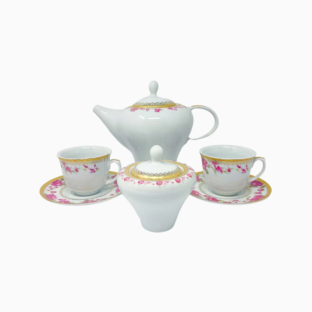 White ceramic tea set with floral patterns on a white background