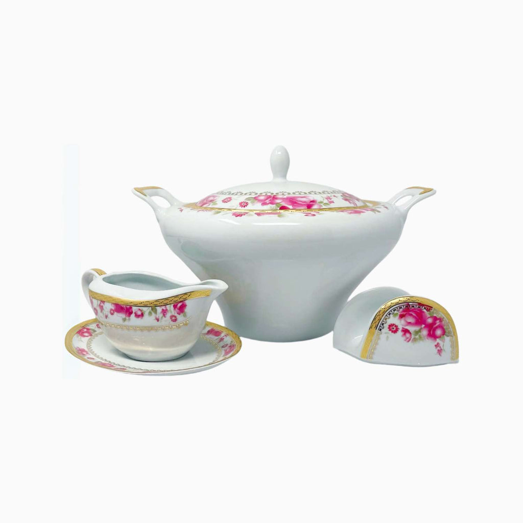 White ceramic teapot set with floral designs on a white background