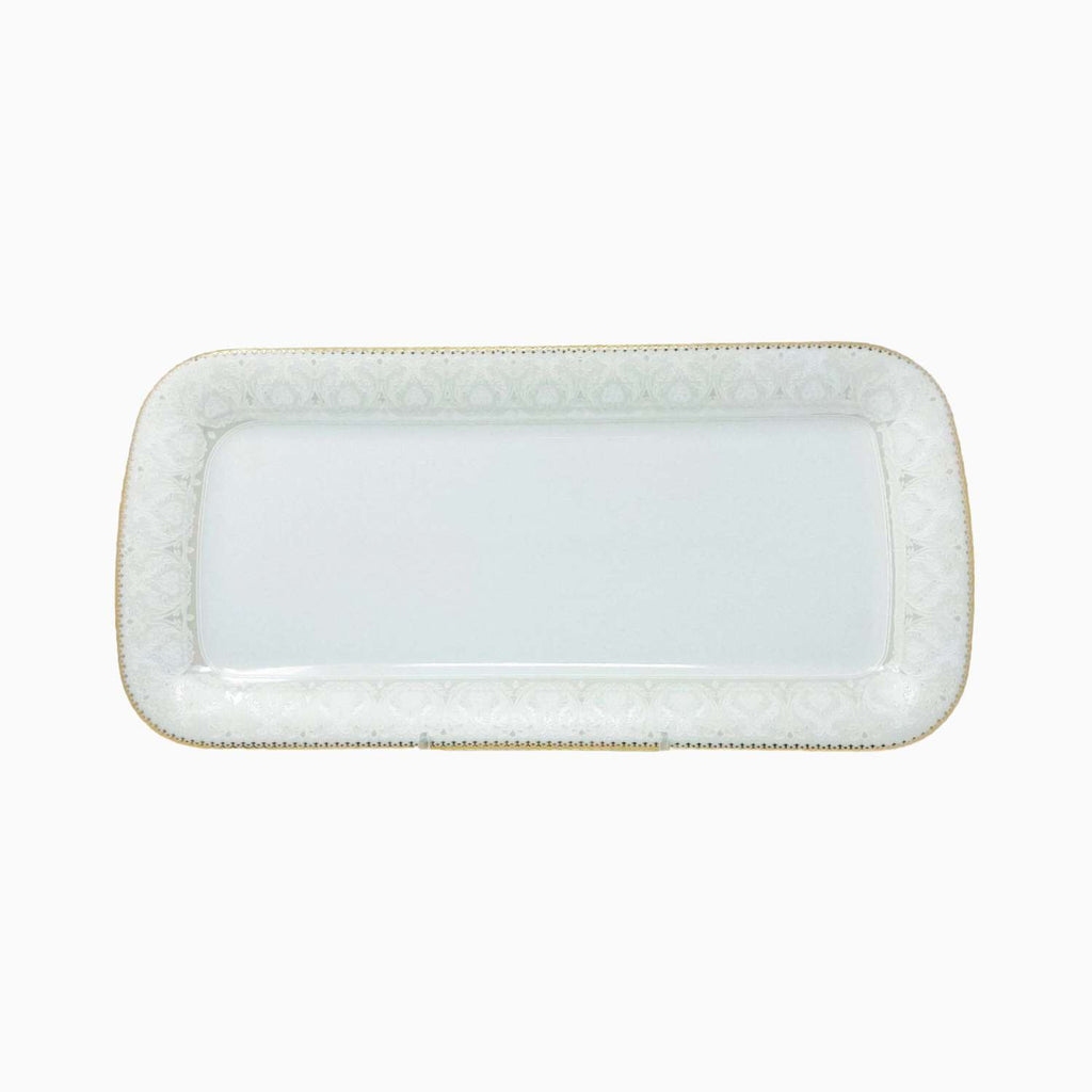 Rectangular white ceramic platter with decorative edge on a white background