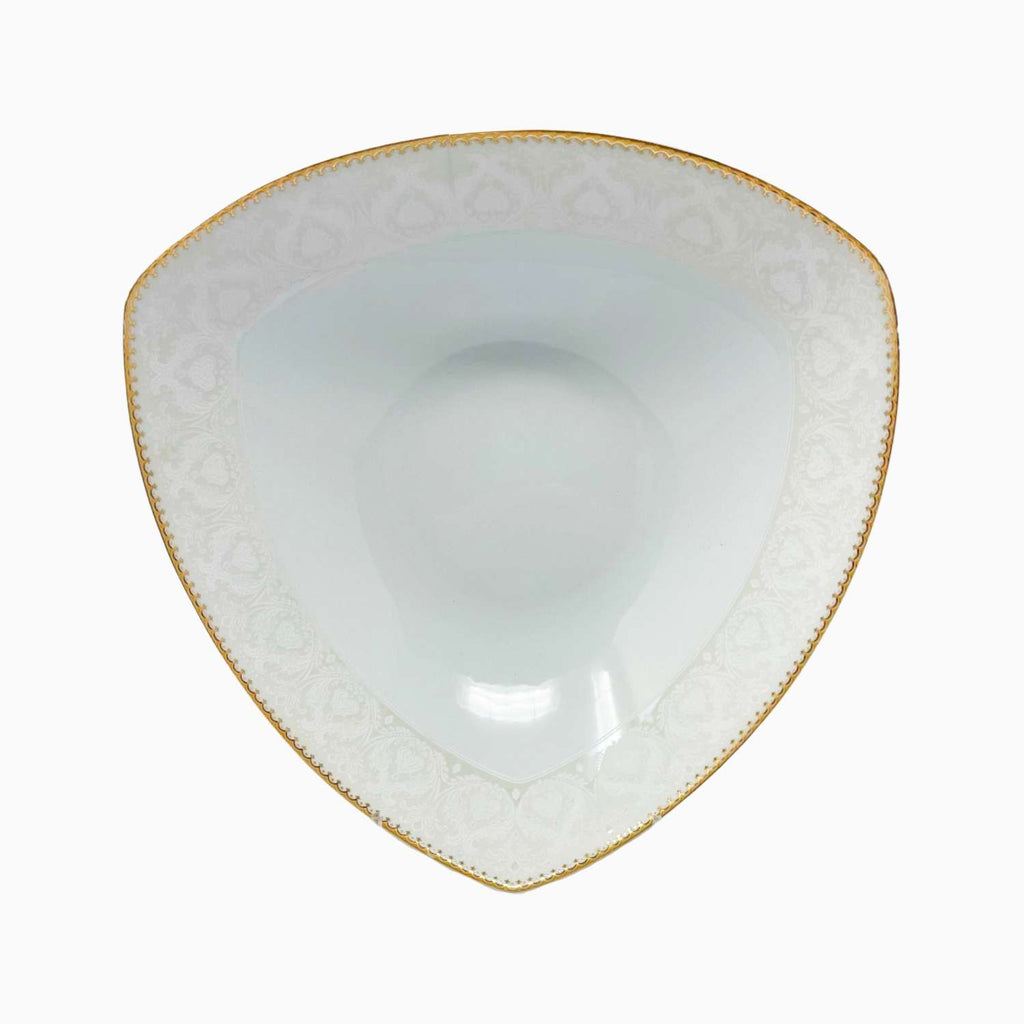 Triangular ceramic bowl with gold rim on a white background