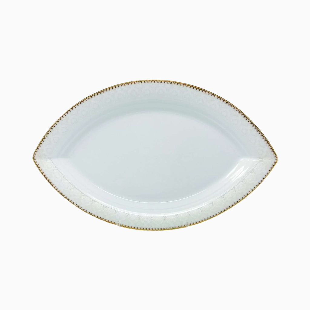 White ceramic platter with gold rim on a white background