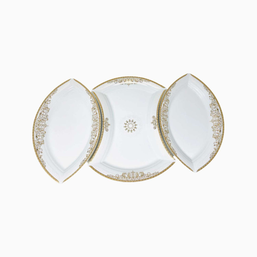 Set of three white plates with gold decorative edges on a white background