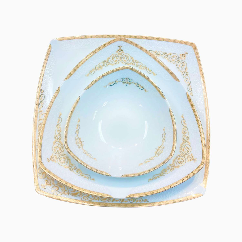 Light blue ceramic plate with gold decorative rim on a white background