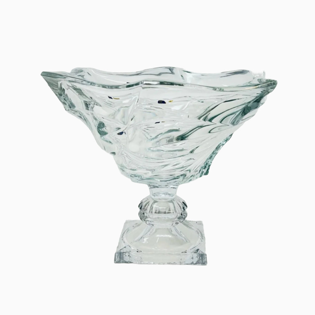 A clear glass decorative bowl with a geometric pattern, displayed on a white background.