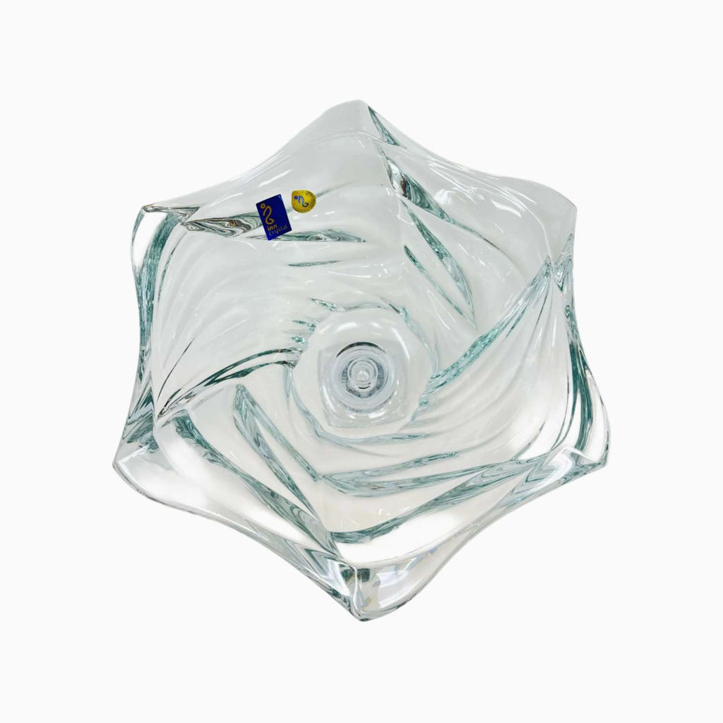 Clear glass bowl flower-shaped object on a white background