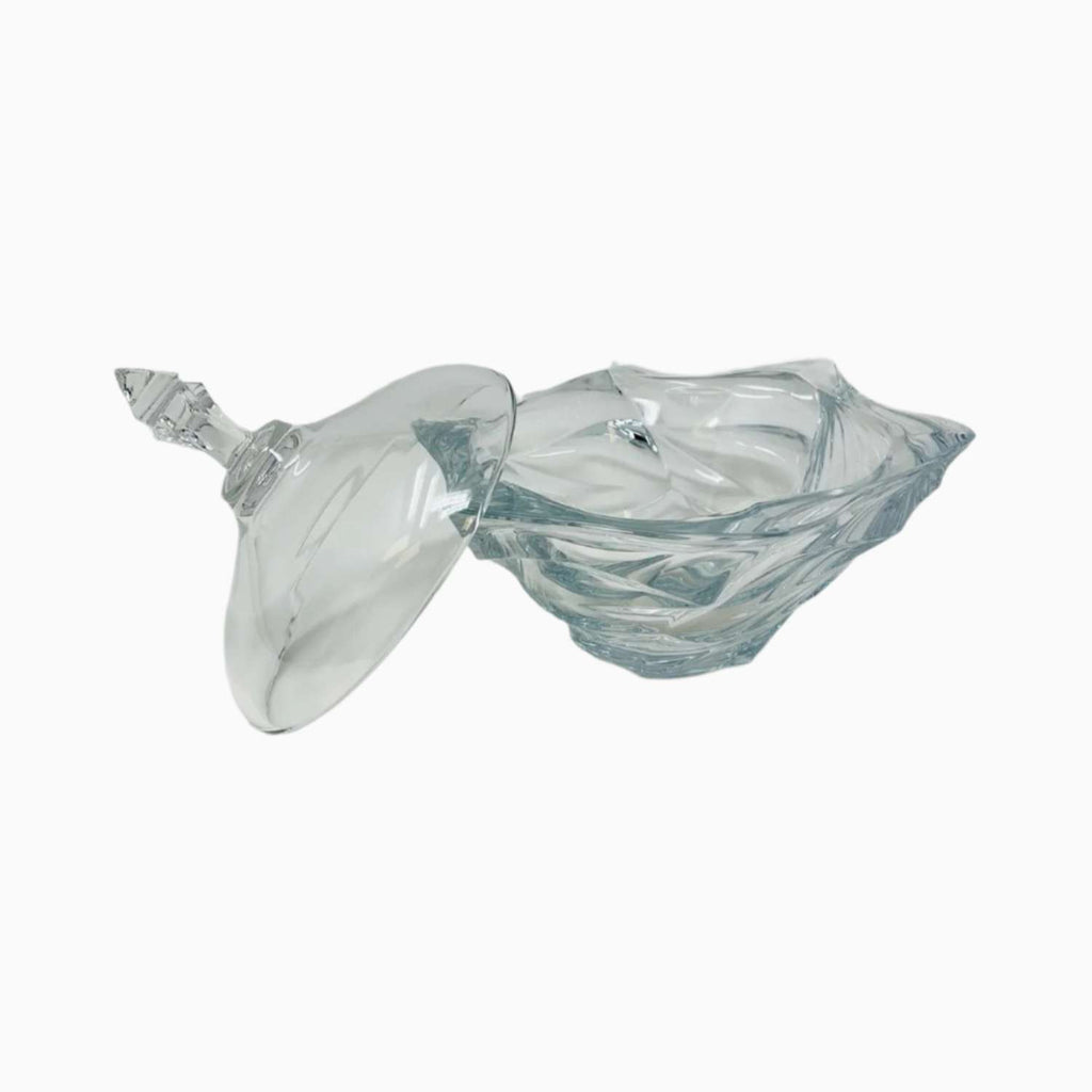 Clear glass candy bowl with lid on a white background