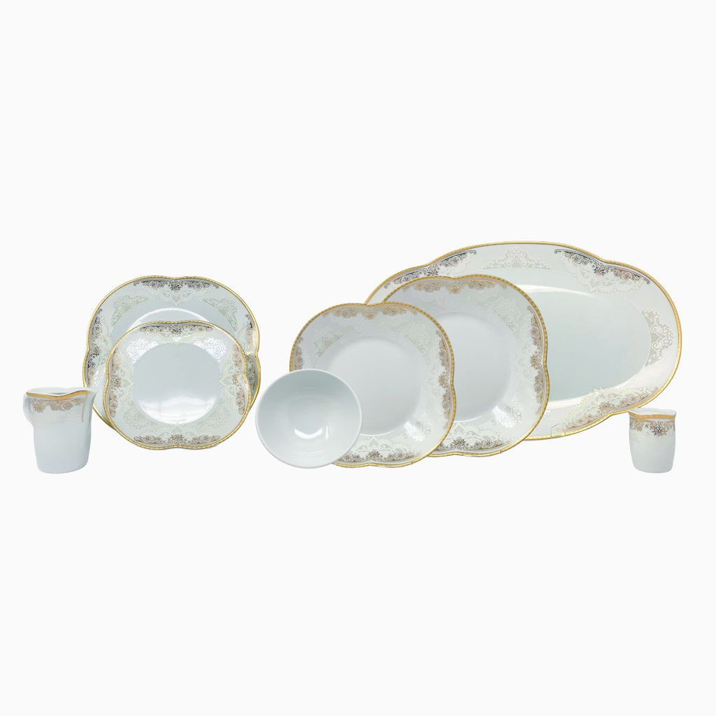 Elegant white porcelain dinnerware set with intricate gold clover detailing, designed for refined and luxurious dining experiences. Noble Home Gifts
