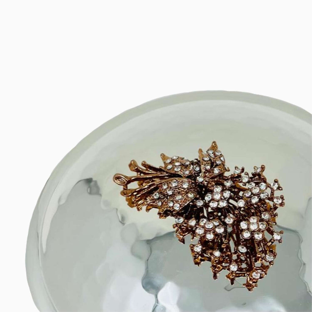 Decorative lid with rose gold on a white background