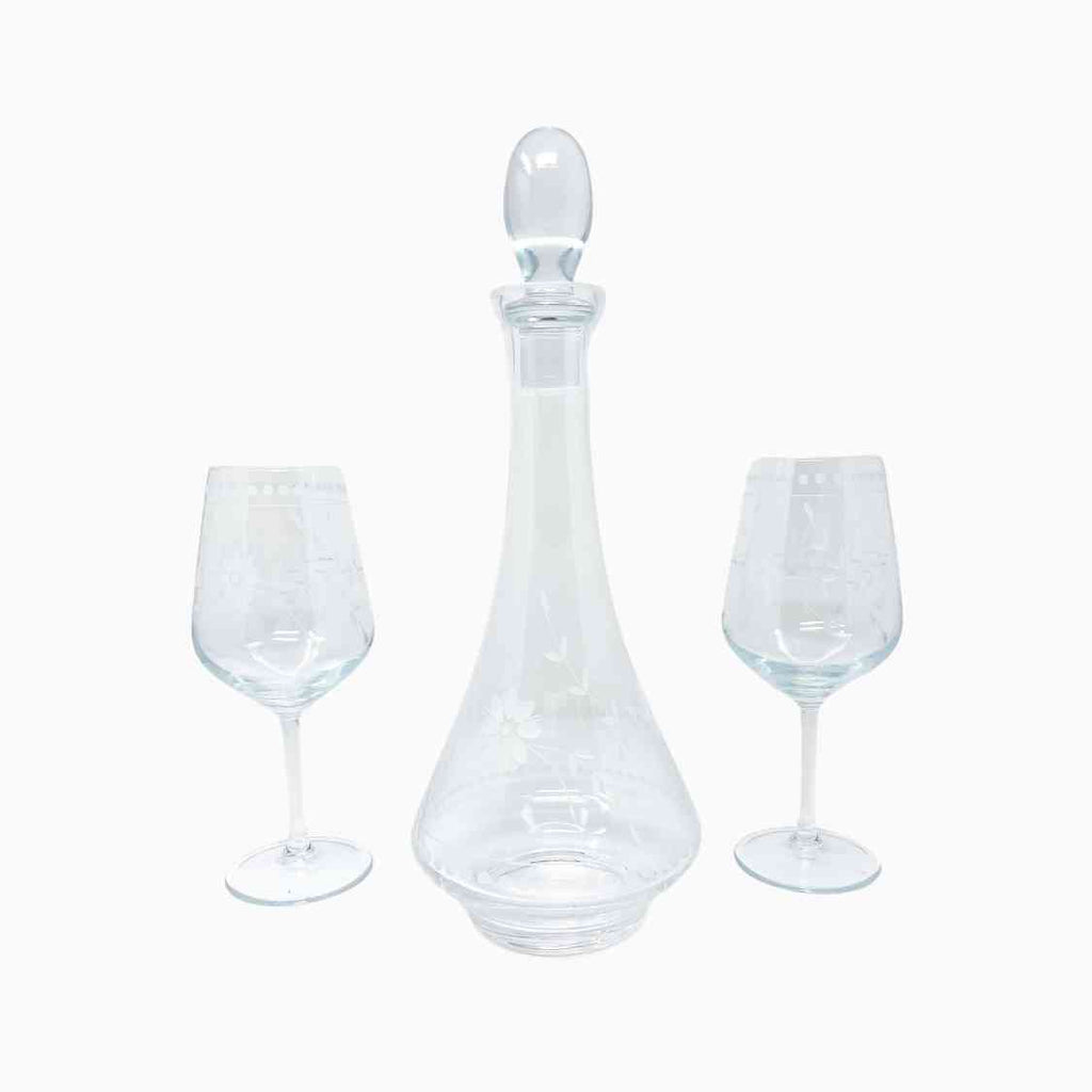 WHITE FLORAL DECORATED WINE VESSEL AND SIX PIECE GLASS SET