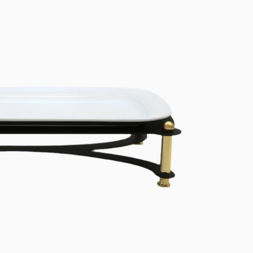 White table with black legs featuring gold accents on a white background
