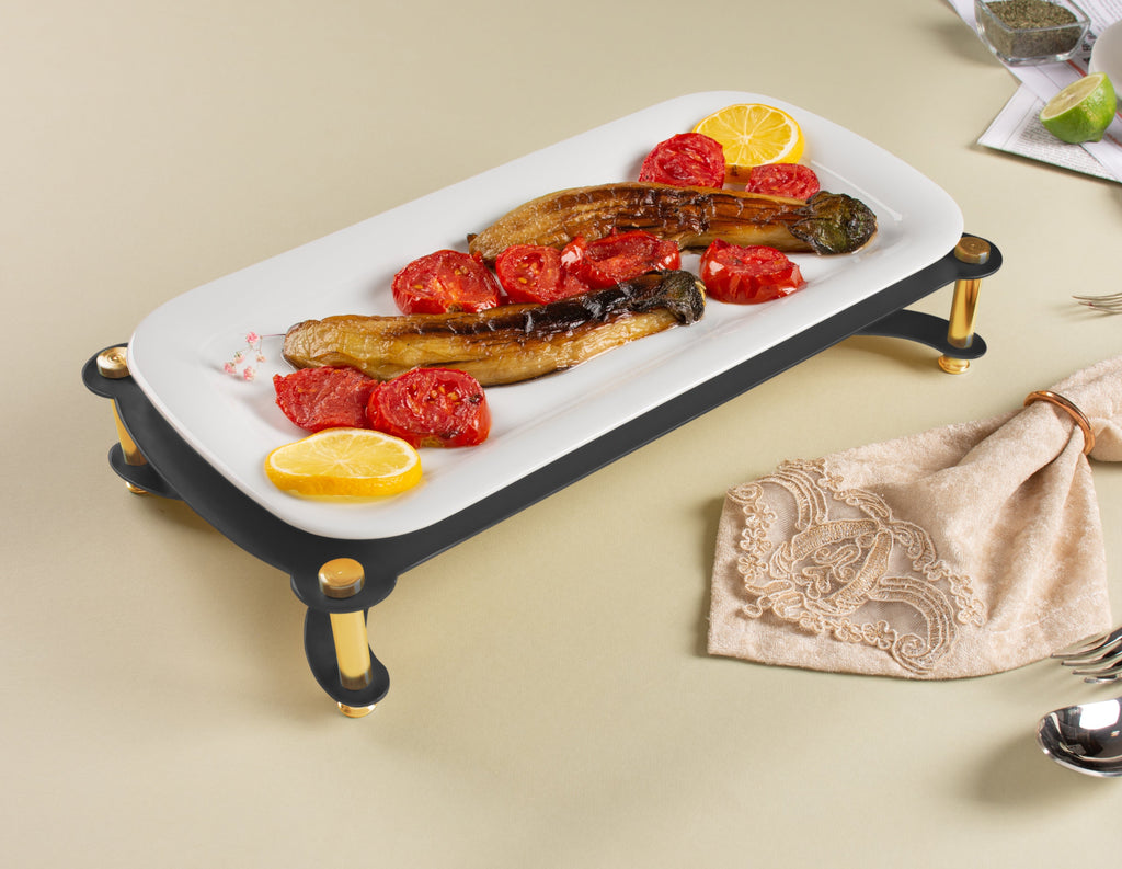 WHITE SERVING PLATE ON BLACK AND GOLD STAND