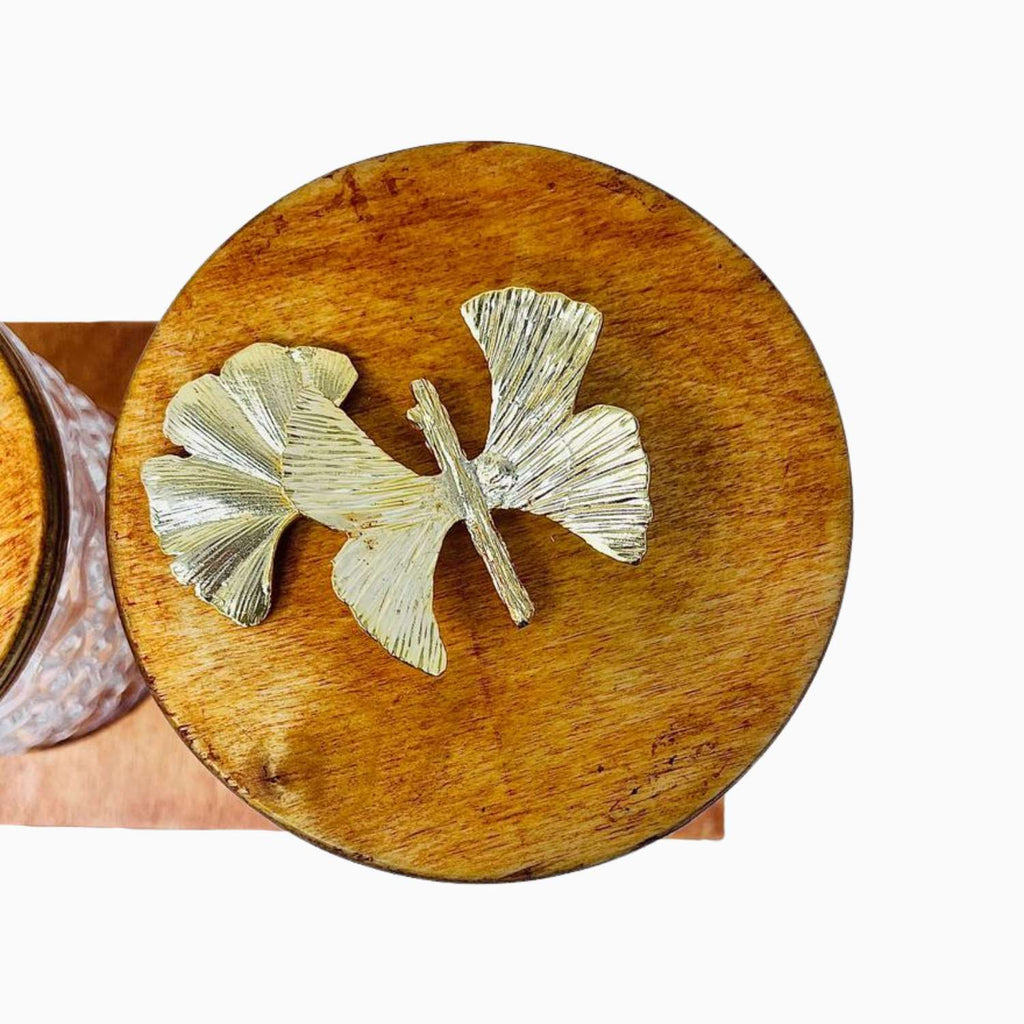 Wooden coaster with a butterfly design on a white background
