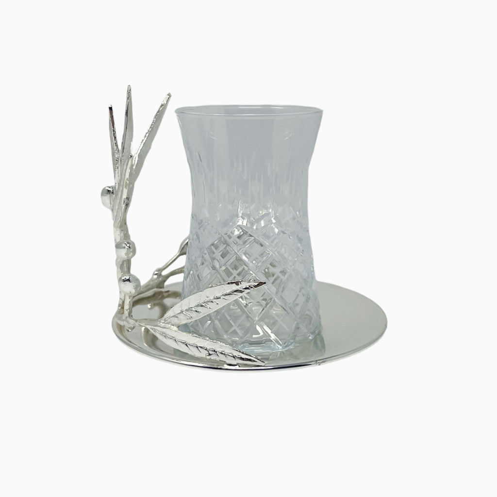 GLASS TEA CUP ON SAUCER