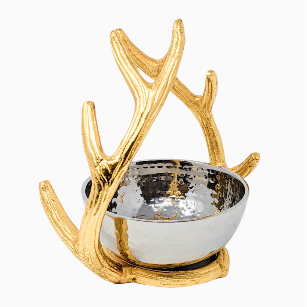 A small, silver bowl with gold antlers, perfect for serving snacks or holding jewelry